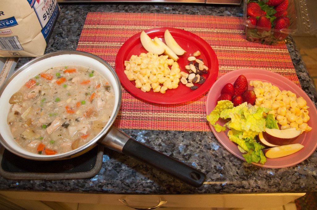 A typical dinnertime scene at our house: one entrée for the grown-ups, another for the kids