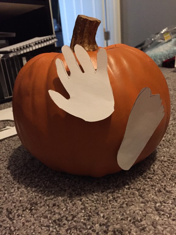 Tracing his hand and foot on paper was much easier than trying to hold it onto the pumpkin and tracing it.