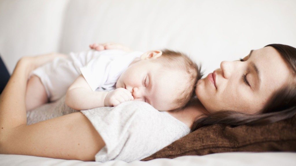 Mom on maternity leave holding her baby